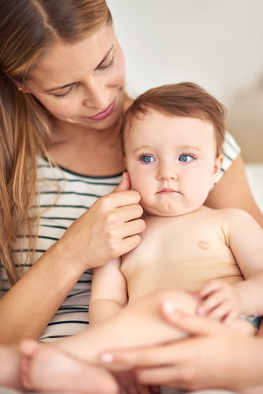 mother holding baby