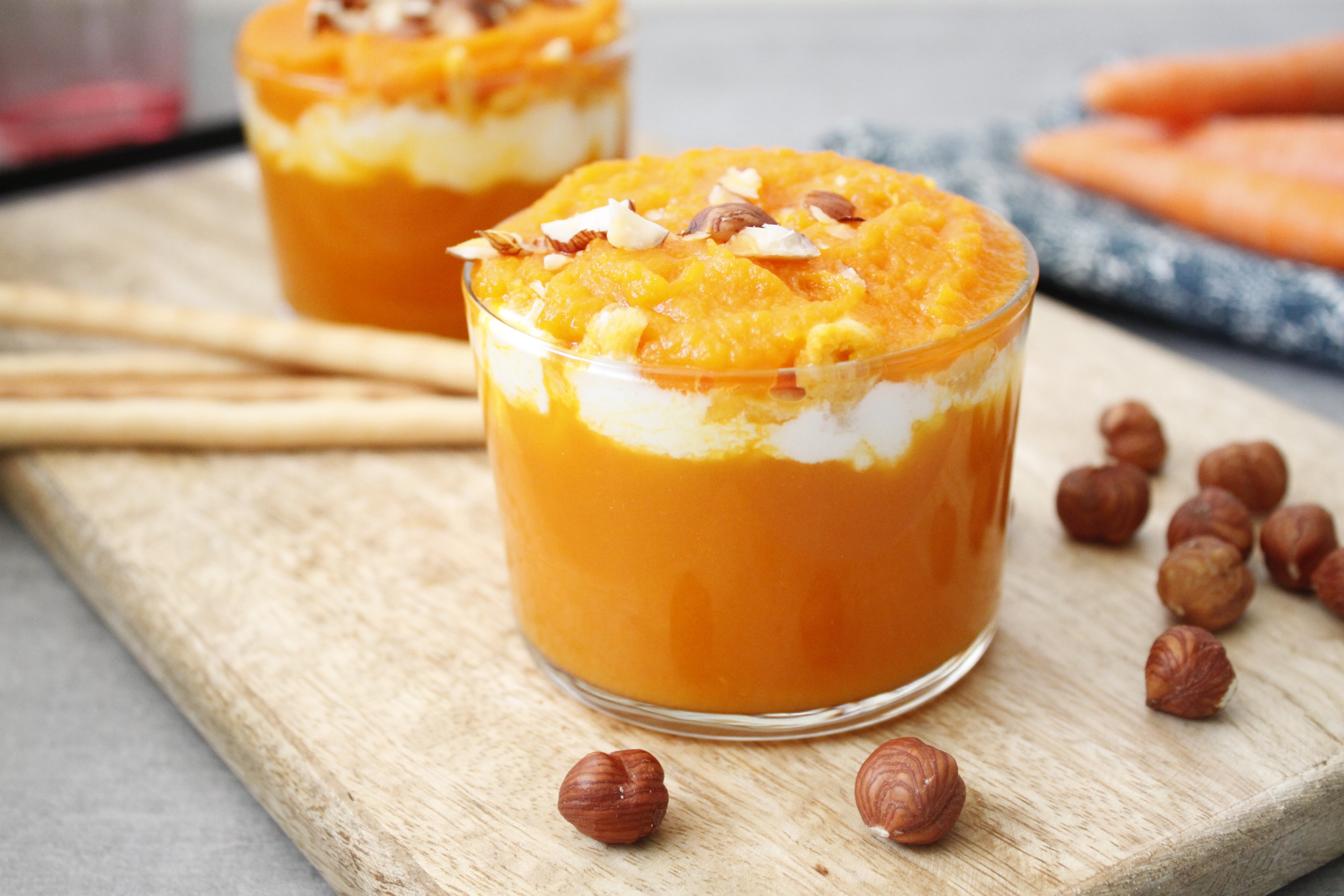 Carrot verrines with goat cheese, hazelnuts and bread sticks