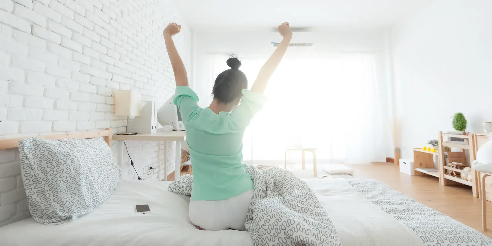 Young Woman Stretching on the bed