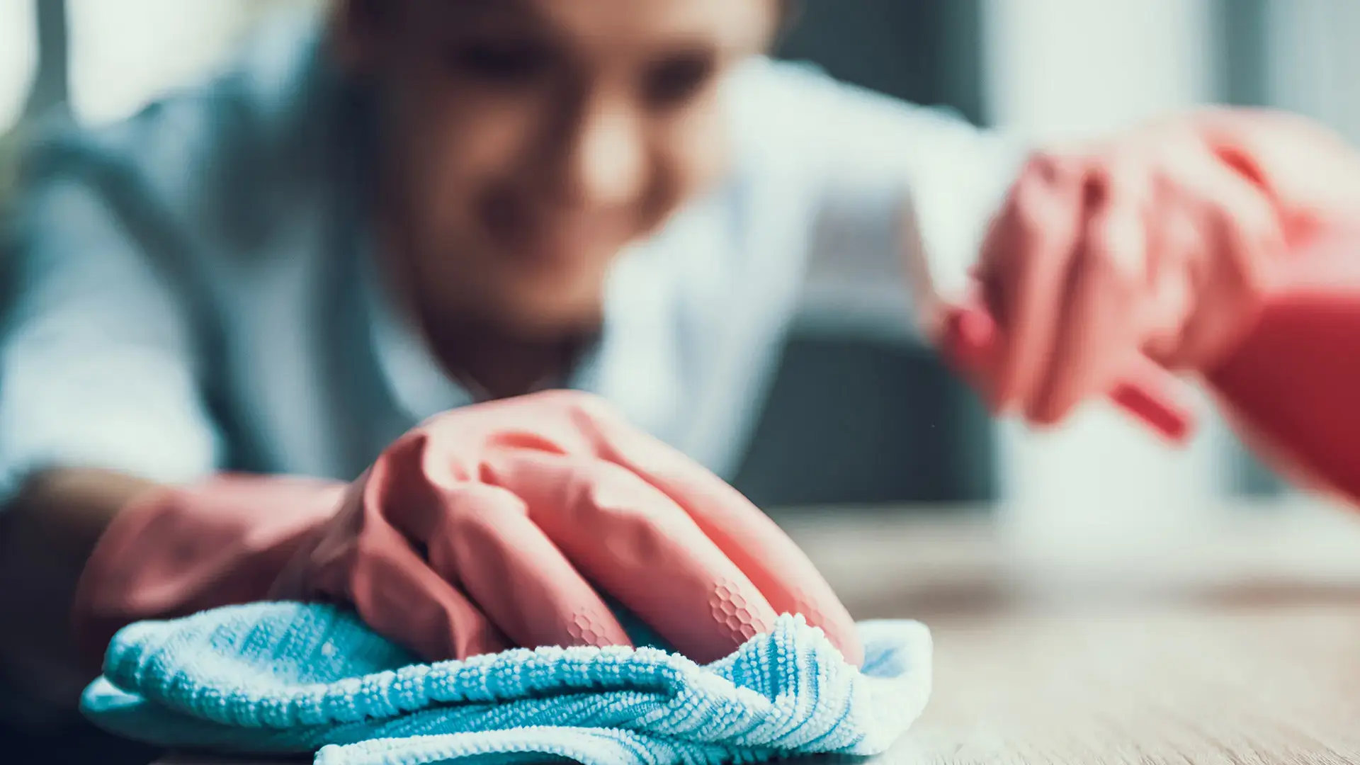 Young Smiling Woman in Gloves Cleaning House