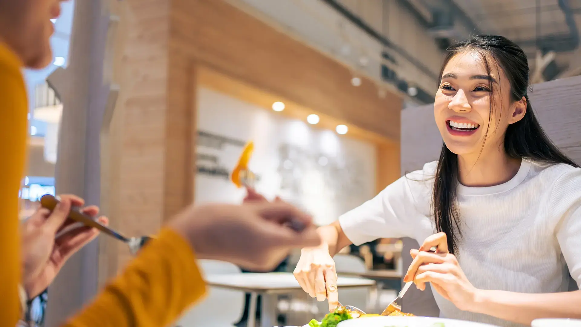 Asian beautiful women having dinner with friend in restaurant together