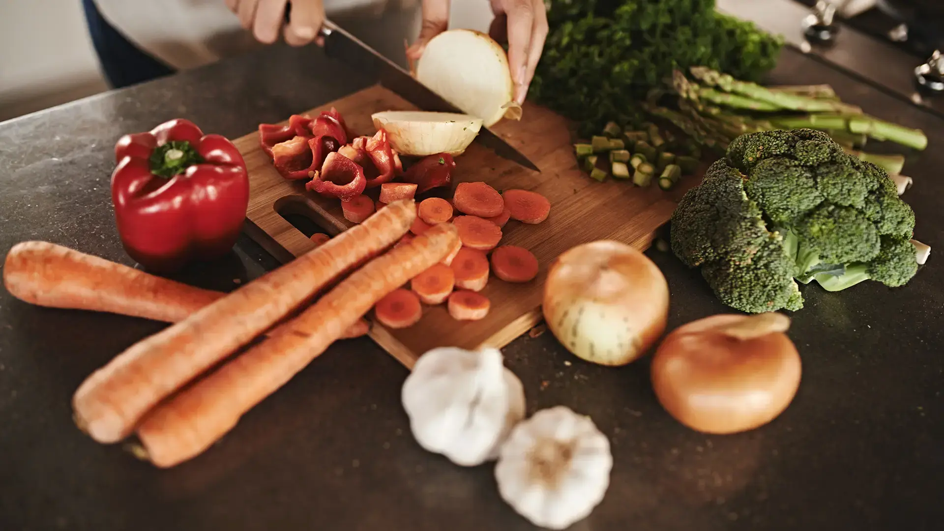 Kitchen, hands and knife with vegetables, chopping board and food with ingredients and diet plan