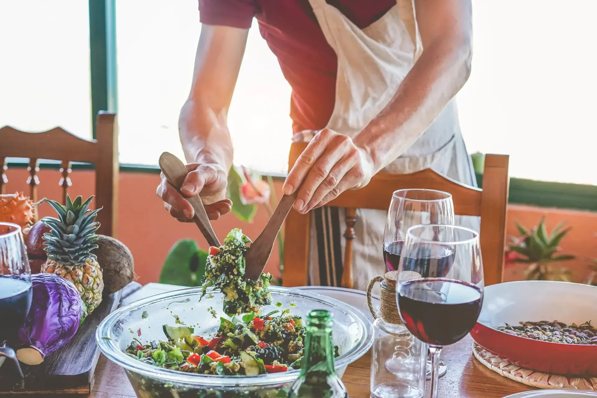 Male chef serving organic vegan salad for dinner