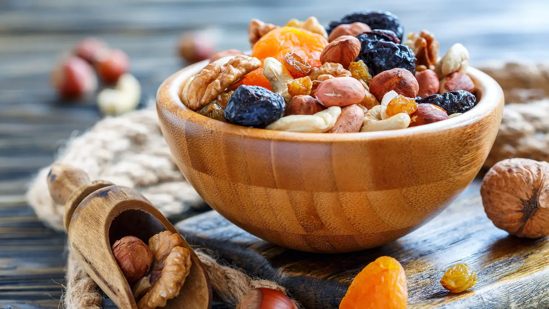 Wooden bowl with nuts and dried fruits
