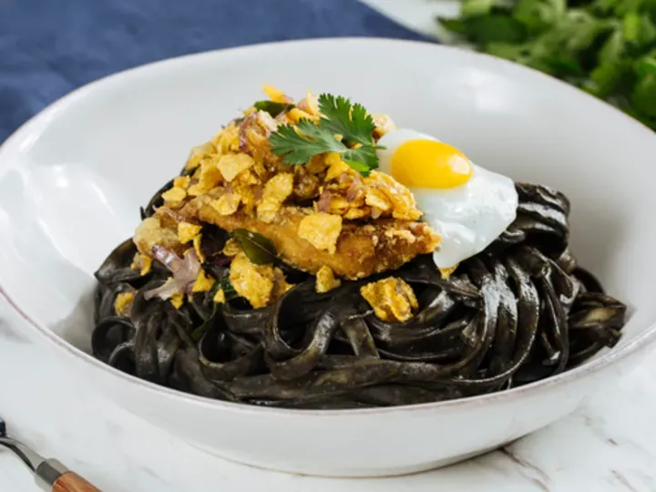 buttered cereal chicken with creamy squid ink laksa pasta